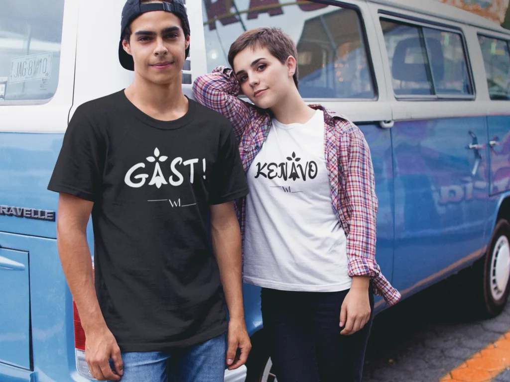 couple-wearing-different-round-neck-tees-mockup-against-a-blue-van-a16443